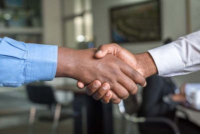 An image of two hands shaking signifying partnership